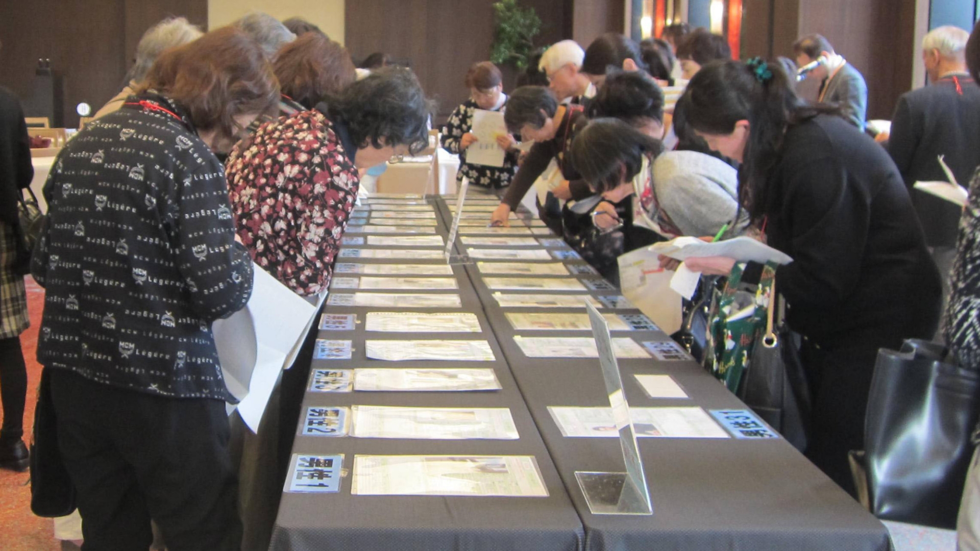 In Tokyo, parents participate in an event where their adult children are matched with potential partners.