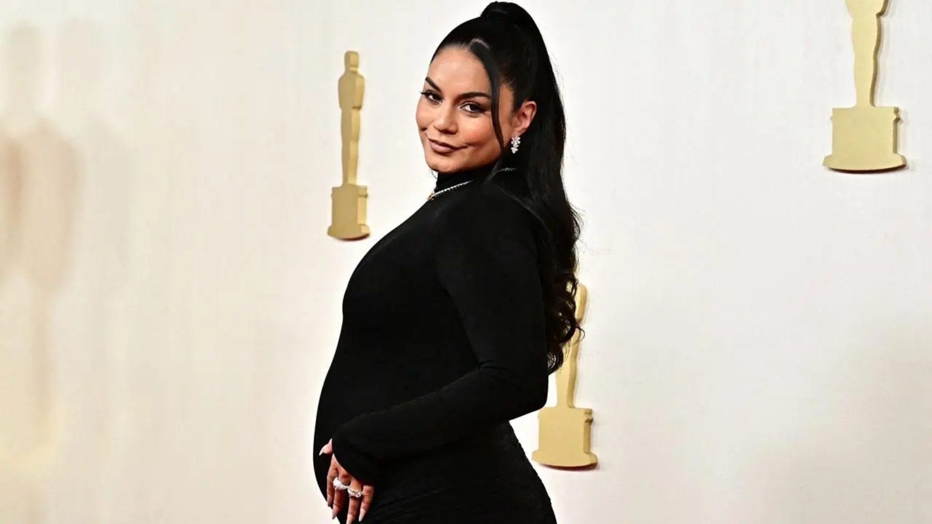 Vanessa Hudgens announces her pregnancy on the Oscar red carpet in 2024.